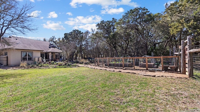 view of yard featuring a garden and fence