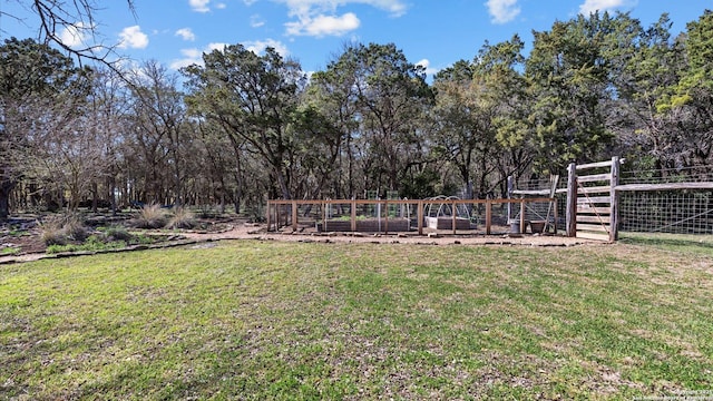 view of yard with a garden and fence