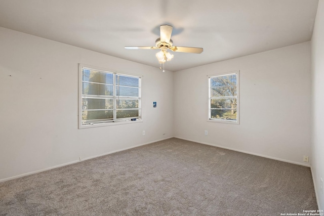 carpeted empty room featuring ceiling fan