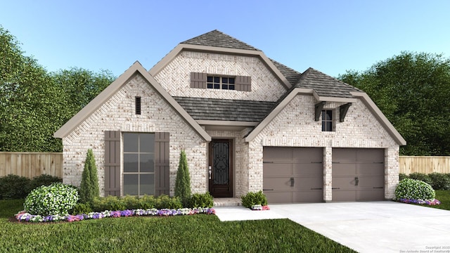 french country inspired facade with brick siding, concrete driveway, an attached garage, and fence