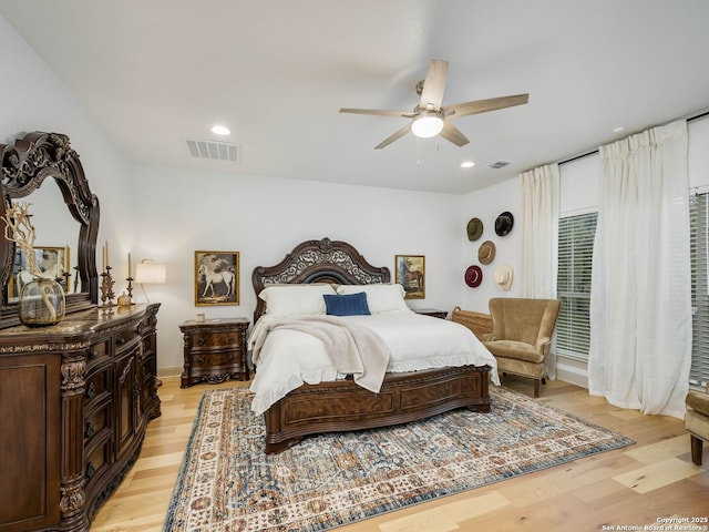 bedroom featuring recessed lighting, visible vents, light wood-style floors, and ceiling fan