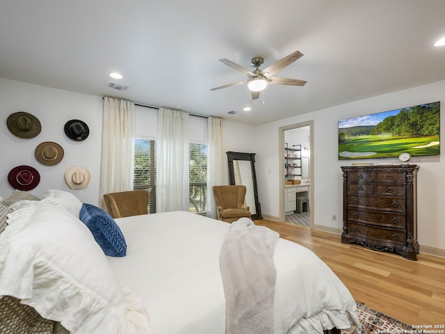 bedroom featuring recessed lighting, visible vents, baseboards, and wood finished floors