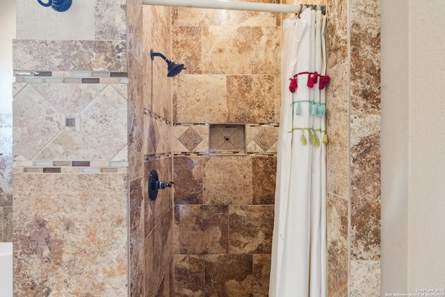 bathroom with a tile shower