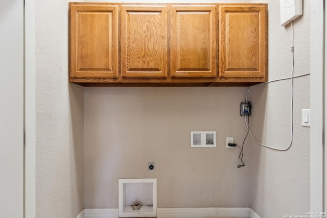 laundry area with cabinet space, electric dryer hookup, and washer hookup