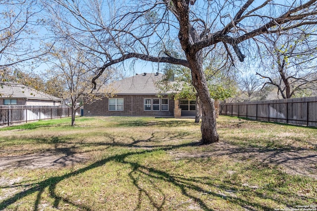 view of yard featuring a fenced backyard