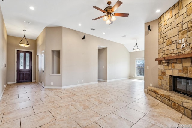 unfurnished living room featuring a stone fireplace, light tile patterned floors, visible vents, and ceiling fan