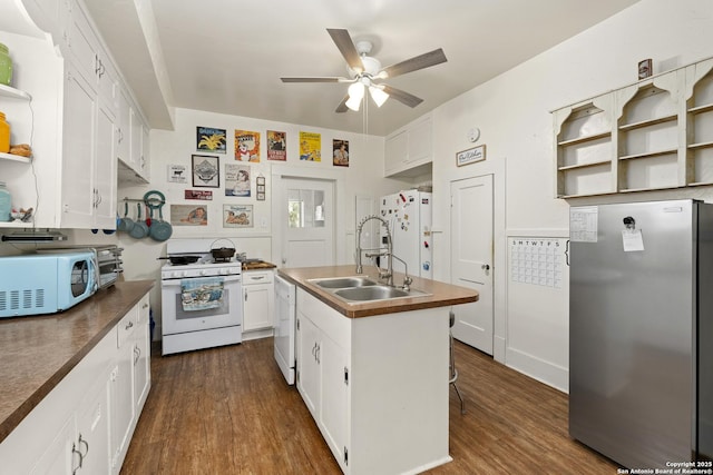 kitchen featuring white appliances, dark wood-style floors, open shelves, a sink, and white cabinets