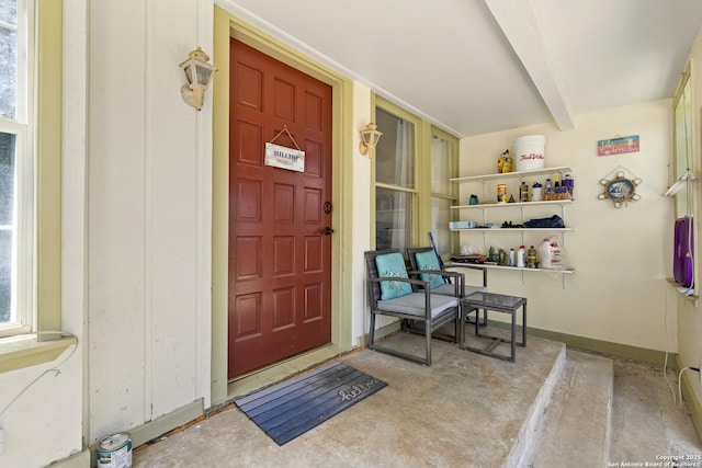 doorway to property featuring covered porch