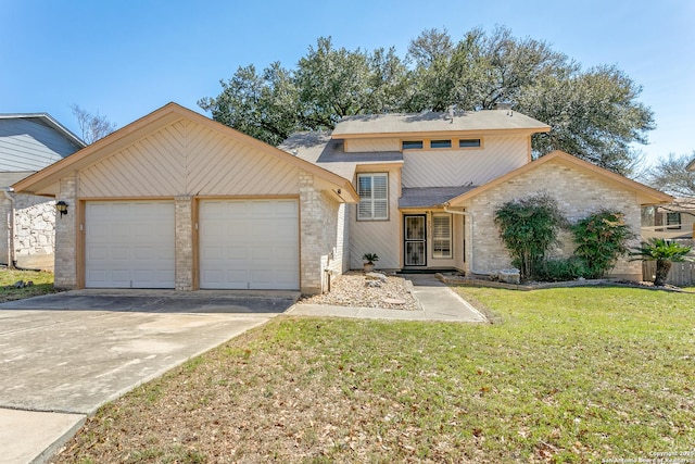 view of front of house with a garage, driveway, and a front lawn