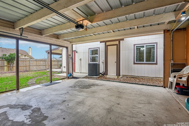 unfurnished sunroom with beamed ceiling