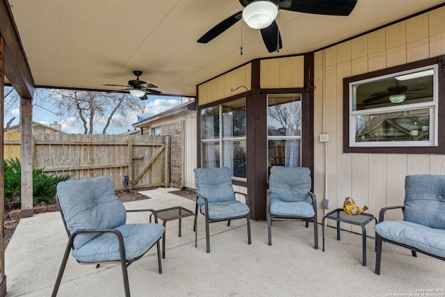 view of patio / terrace featuring fence and ceiling fan