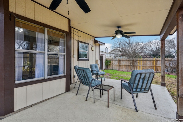 view of patio / terrace with a ceiling fan and fence