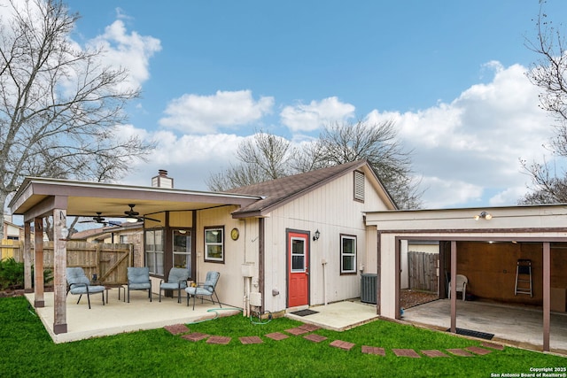 back of property with central AC unit, a ceiling fan, a patio, and fence