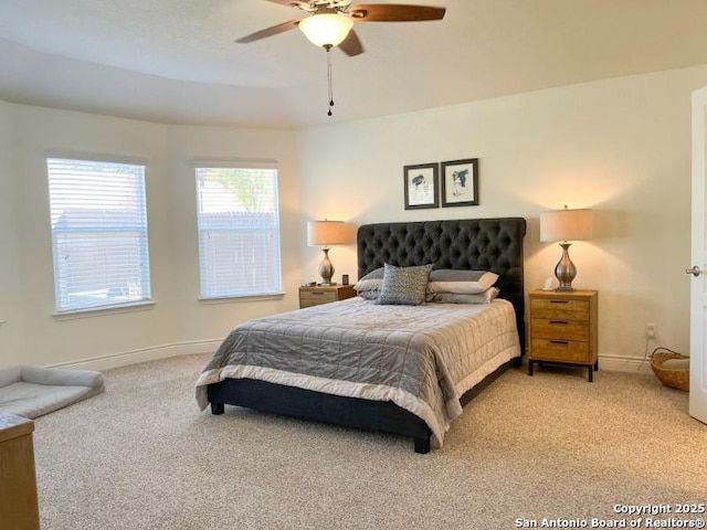 bedroom featuring baseboards, carpet floors, and ceiling fan