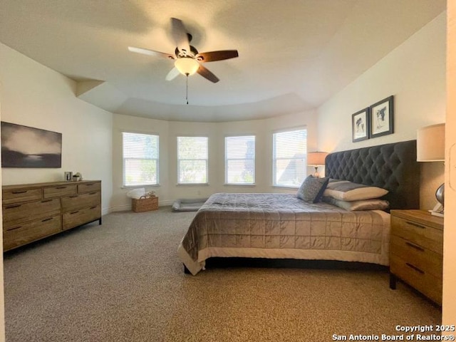 bedroom with baseboards, carpet floors, and a ceiling fan