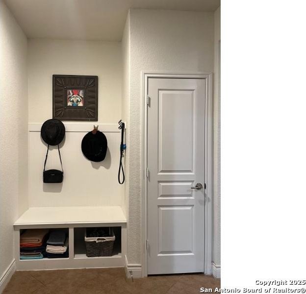 mudroom with tile patterned floors