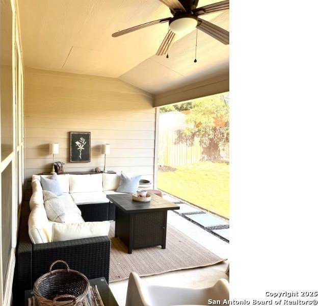 view of patio with a ceiling fan, fence, and an outdoor hangout area