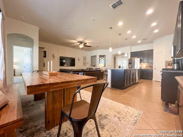 dining room featuring visible vents, crown molding, recessed lighting, light tile patterned flooring, and a ceiling fan