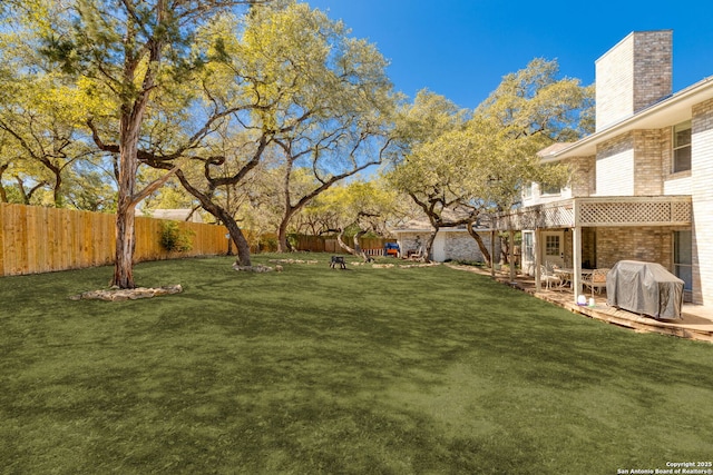 view of yard featuring a patio and a fenced backyard