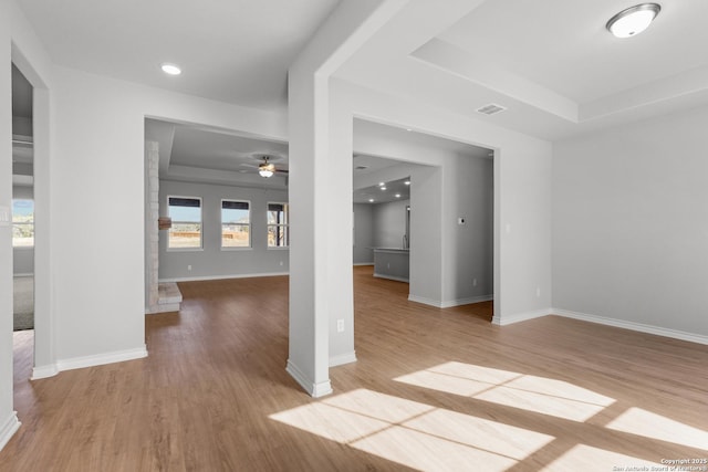 spare room featuring visible vents, a ceiling fan, wood finished floors, recessed lighting, and baseboards