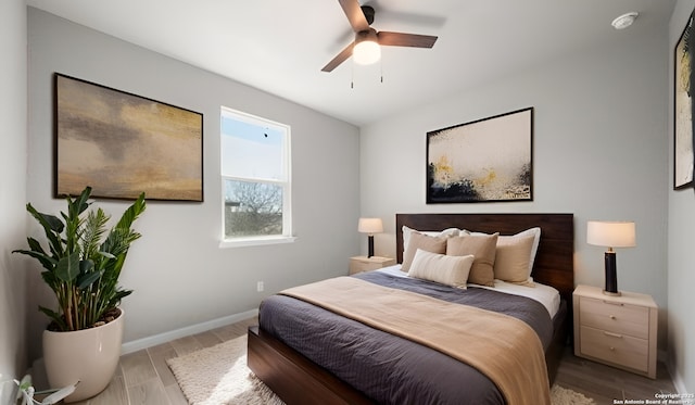 9915 Loma Alta Cir, Converse, TX 78109 - bedroom with light wood-style floors, baseboards, and ceiling fan