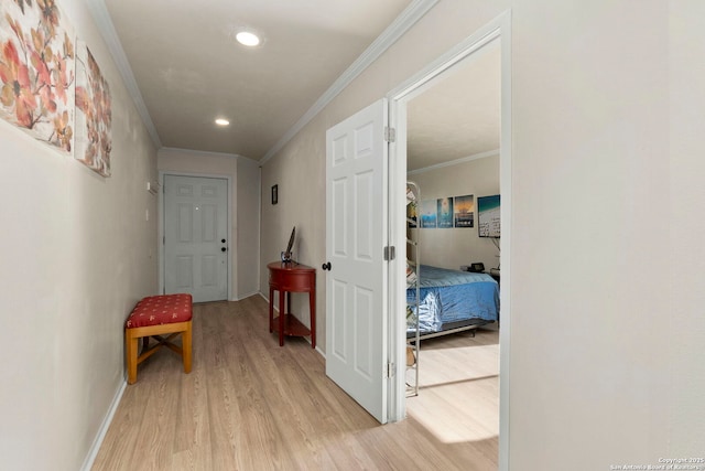 hall featuring recessed lighting, light wood-type flooring, baseboards, and ornamental molding