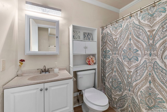 full bathroom with toilet, vanity, and ornamental molding