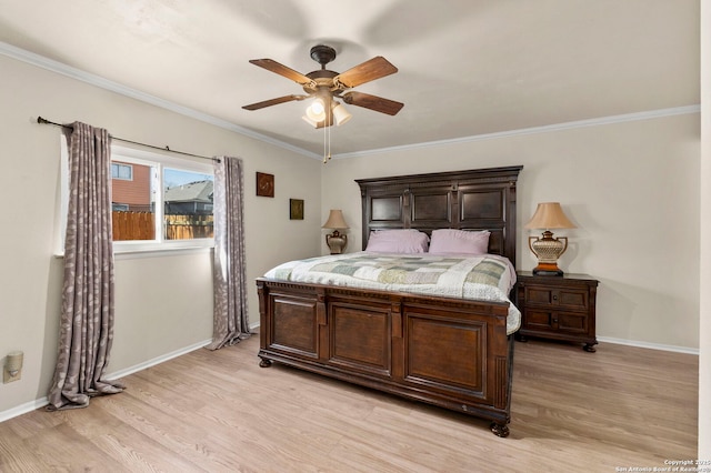 bedroom featuring baseboards, light wood-style floors, and ornamental molding