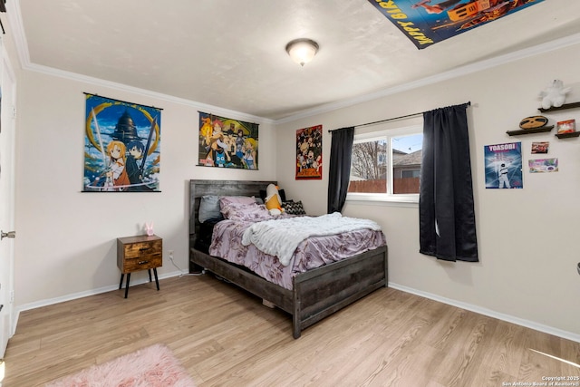 bedroom featuring crown molding, baseboards, and light wood-type flooring