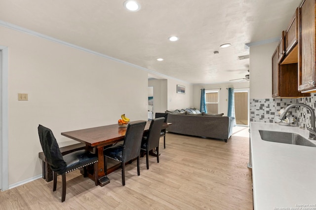 dining area featuring crown molding, recessed lighting, light wood finished floors, and ceiling fan