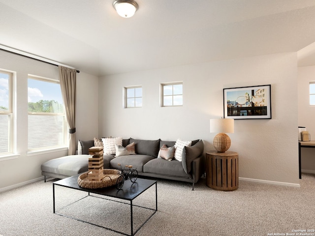 living room featuring carpet flooring and baseboards