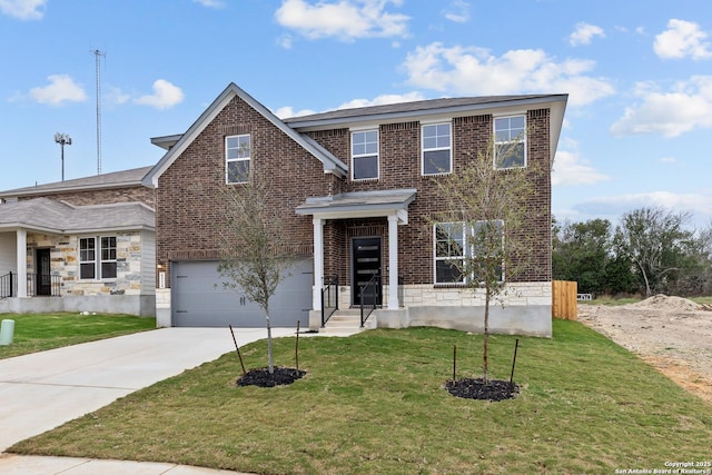 traditional-style house with concrete driveway, a garage, stone siding, and a front yard