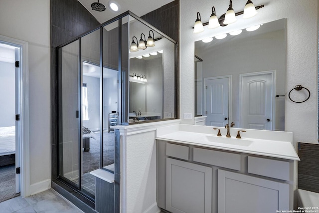 ensuite bathroom with vanity, a stall shower, marble finish floor, and connected bathroom