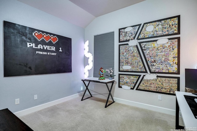 carpeted home office with vaulted ceiling and baseboards