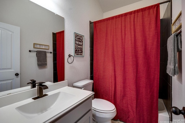 bathroom featuring shower / bathtub combination with curtain, toilet, vanity, and a textured wall