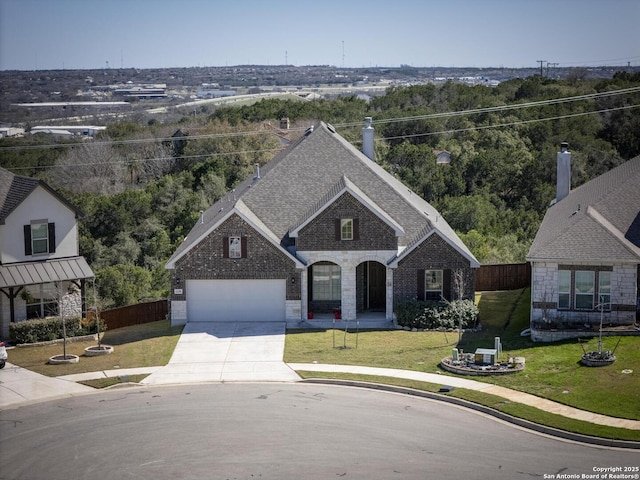 view of front of home featuring brick siding, a front yard, and fence