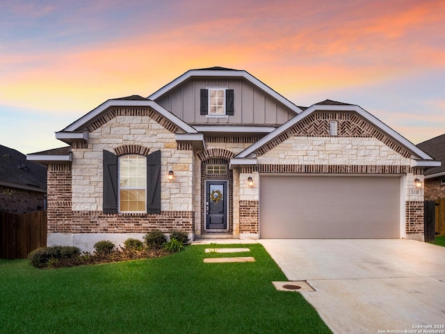 french country style house with an attached garage, brick siding, board and batten siding, and driveway