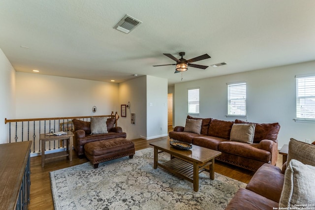 living room with recessed lighting, visible vents, wood finished floors, and ceiling fan