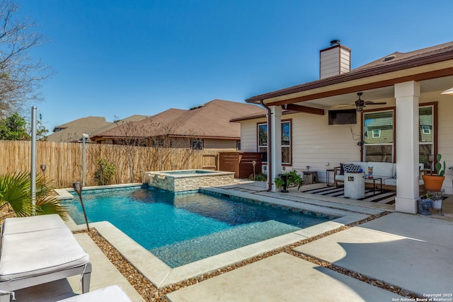 view of pool with a patio, a fenced backyard, a pool with connected hot tub, and ceiling fan