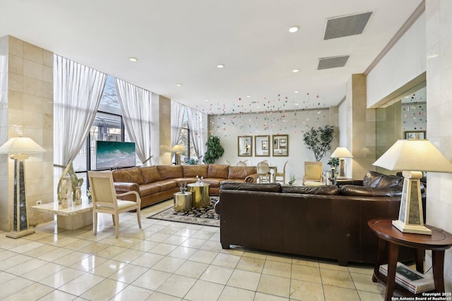 living room with light tile patterned flooring, recessed lighting, and visible vents