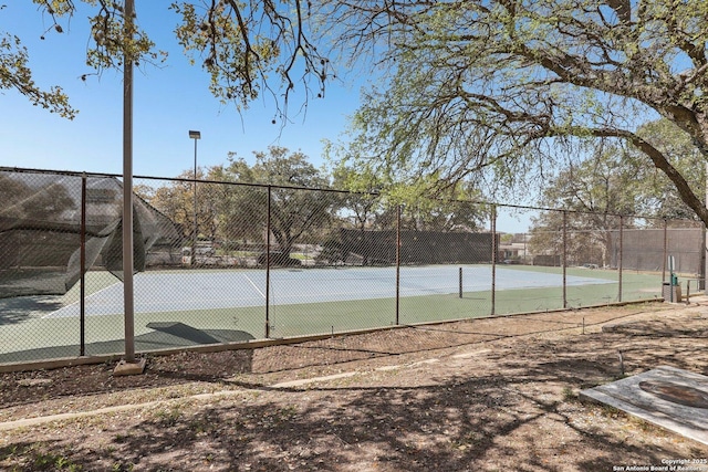 view of sport court with fence