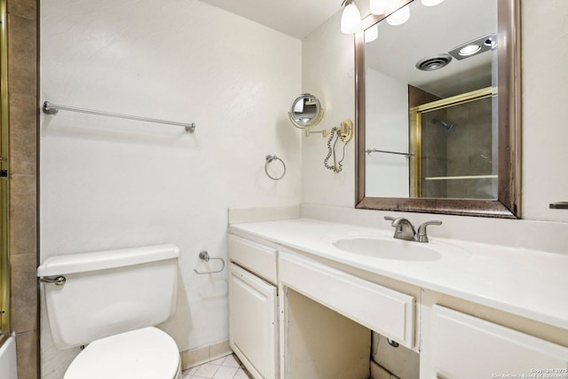 bathroom with toilet, tile patterned floors, an enclosed shower, and vanity