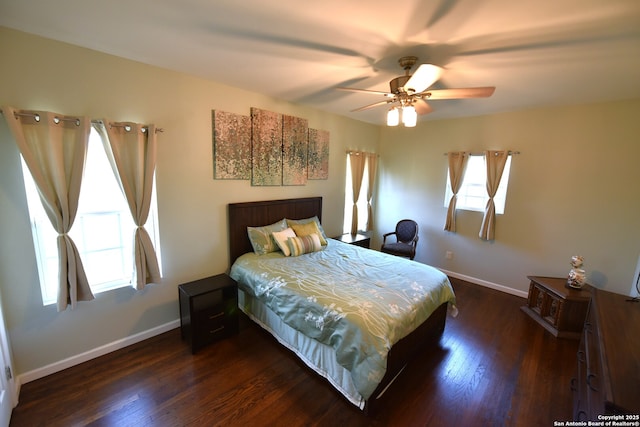 bedroom featuring ceiling fan, baseboards, and dark wood-style floors