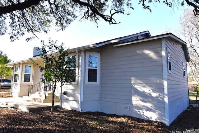 view of side of property featuring crawl space