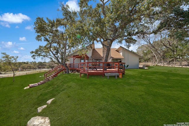 view of yard with a wooden deck