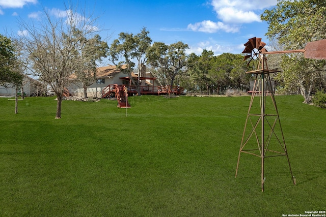 view of yard featuring a wooden deck