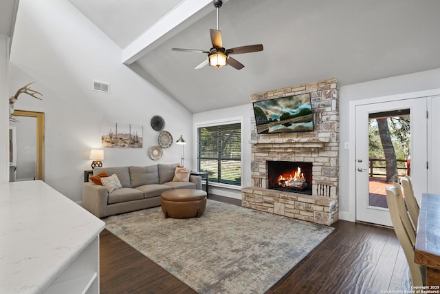 living room with plenty of natural light, visible vents, and dark wood-style flooring