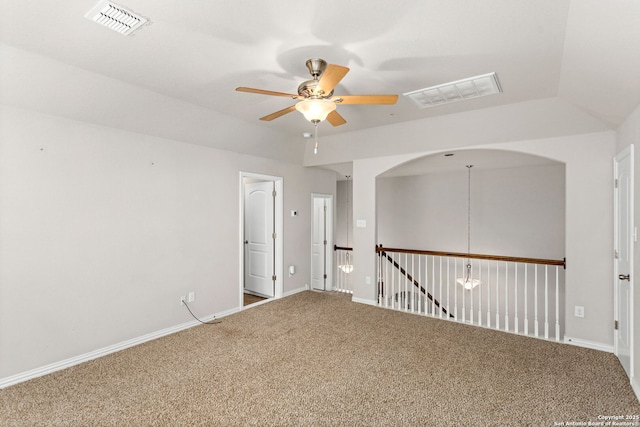 unfurnished room featuring visible vents, baseboards, carpet, and a ceiling fan