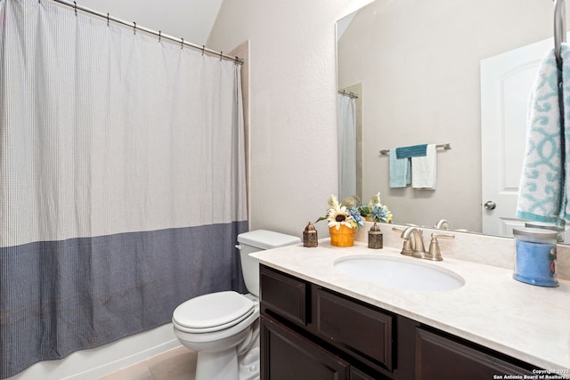 full bathroom featuring tile patterned floors, toilet, and vanity