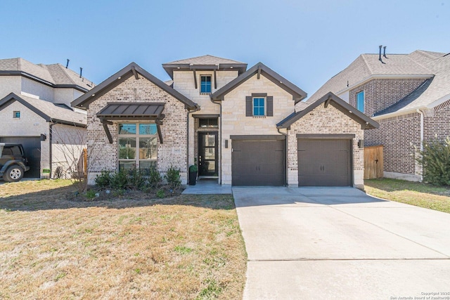 view of front facade featuring concrete driveway, a front lawn, a garage, stone siding, and brick siding